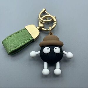 Charming Black and Green Character Keychain